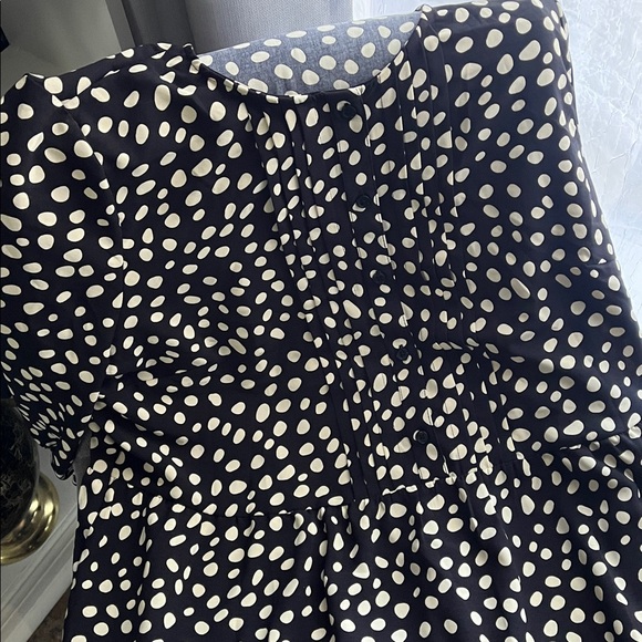 2 dresses. Black Polka Dot Tiered Dress & Solid Black Ruffle Hem Dress - Picture 3 of 7